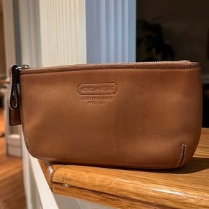 COACH tan leather pouch.